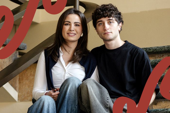 A girl and a boy sitting on the stairs.