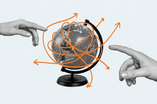 Hands pointing at a globe