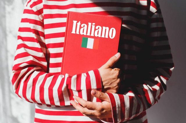 Girl with an Italian dictionary in her hands
