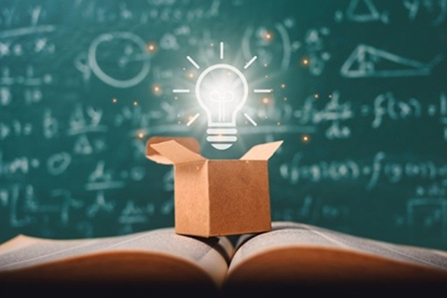 Graphic image of a light bulb on an open book.