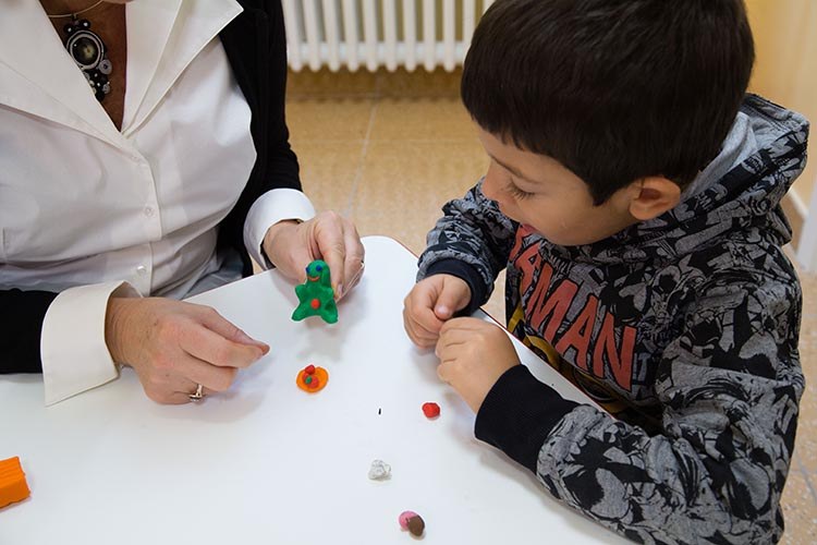 Child playing with an adult
