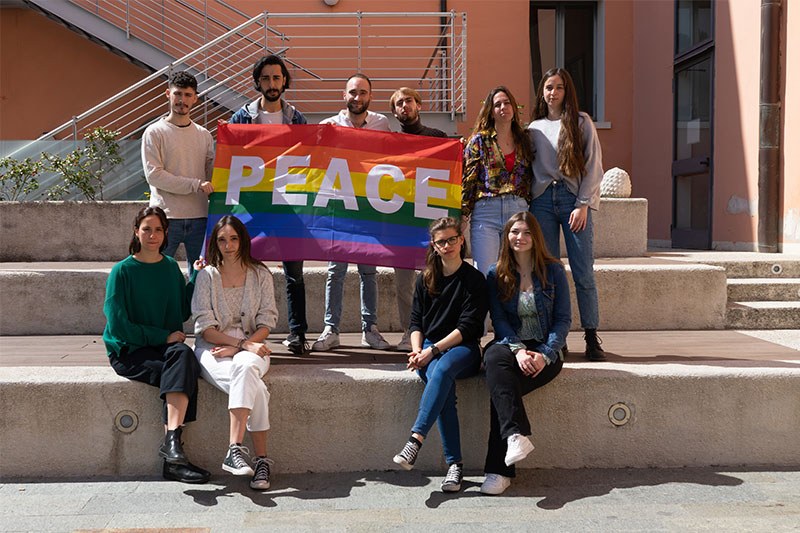Students holding the peace flag
