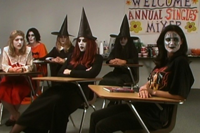 Girls dressed as witches during a theatrical performance