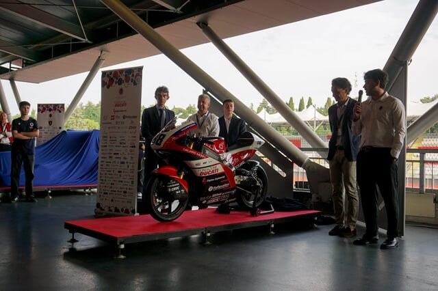UniBo Motorsport team with one of their vehicles