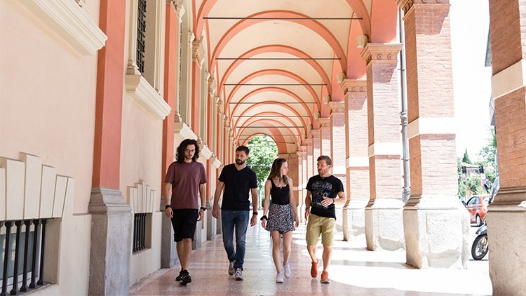 Young people walking under the portico